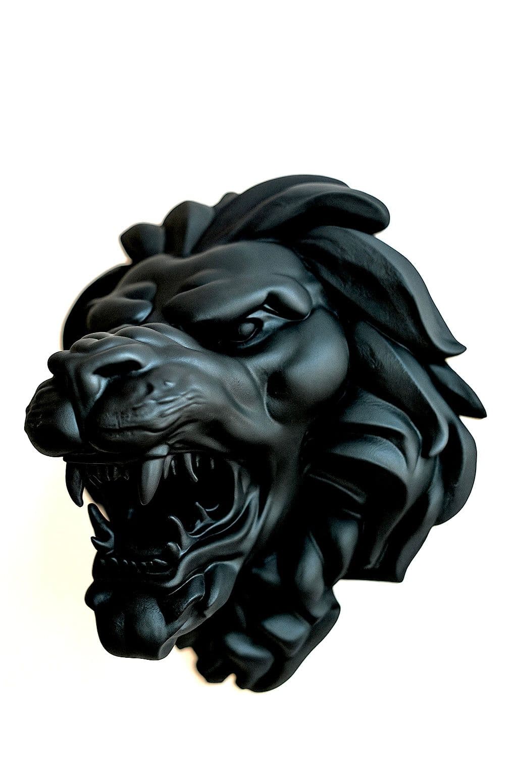 Detailed black lion head sculpture, roaring with bared teeth and flowing mane.